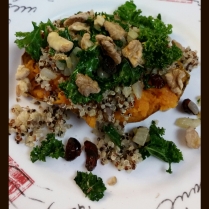 Baked sweet potatoes topped with sauteed onion, kale, dried cranberries, tri-colored quinoa, and walnuts
