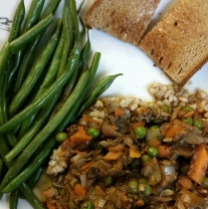 Mushroom, carrot, onion, peas, garlic in a red wine reduction served over pearl barley with a side of green beans and garlic-buttered toast.